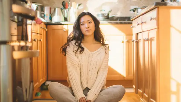 woman sitting in kitchen
