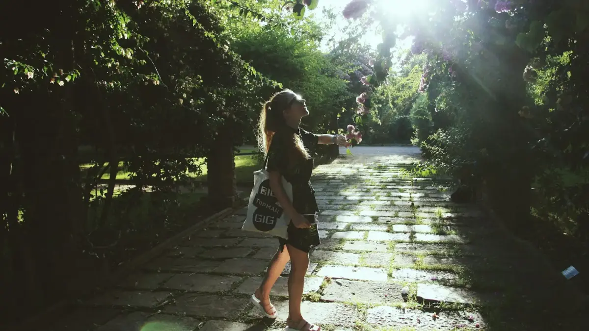 woman wears black elbow-sleeved dress