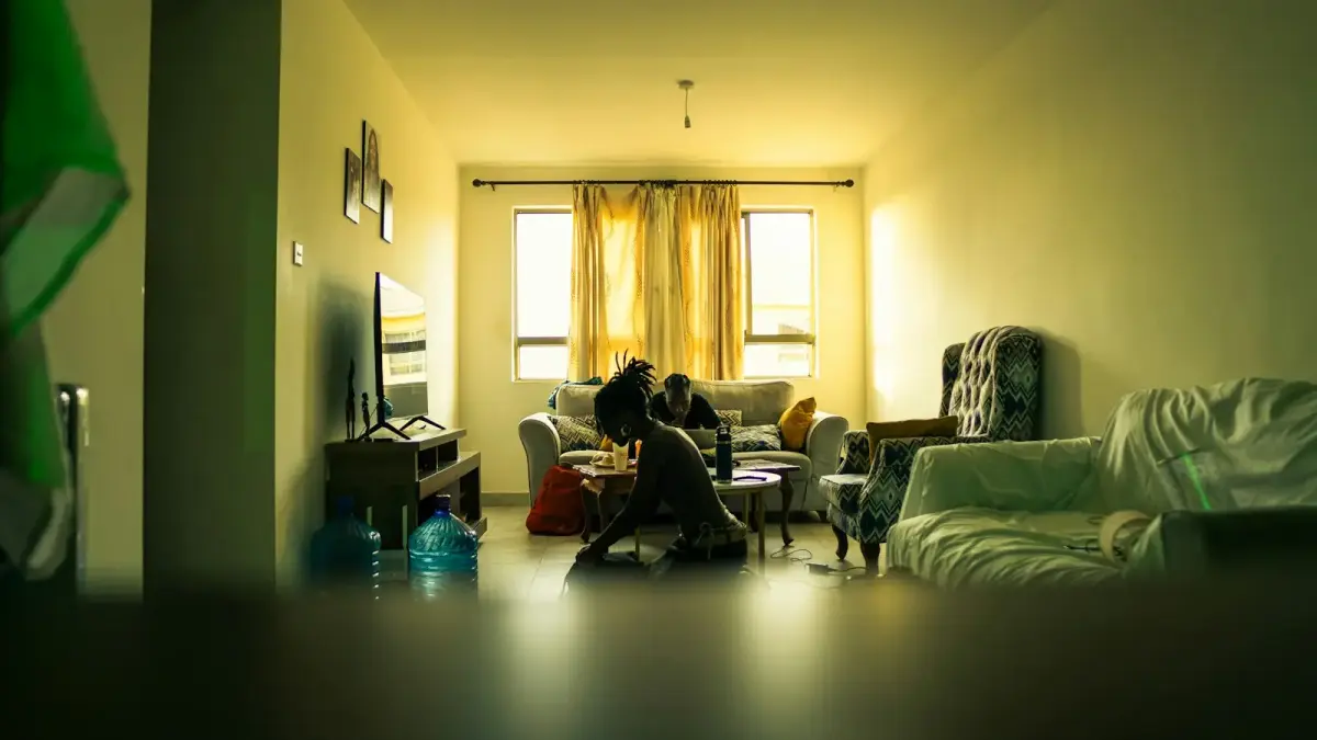 People in a living room with warm lighting