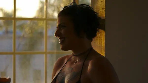 smiling woman wearing brassiere