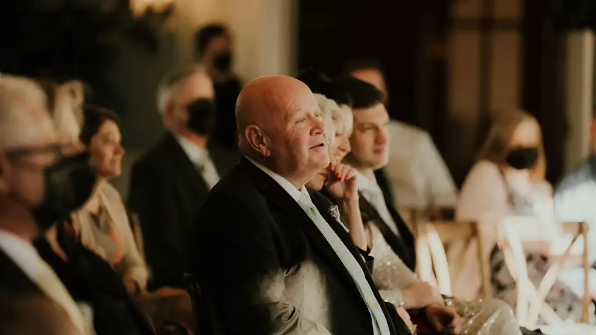 a group of people sitting next to each other