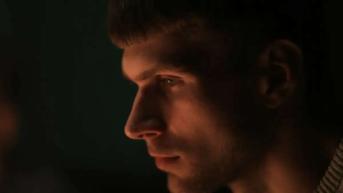 a close up of a man with a serious look on his face