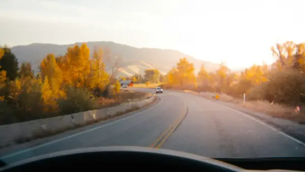 Driving on a scenic road at sunset