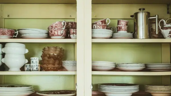 white ceramic bowl on brown wooden cabinet