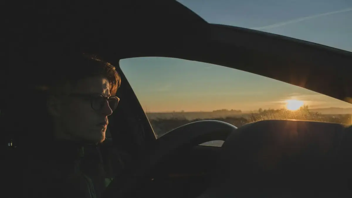 man driving car during daytime
