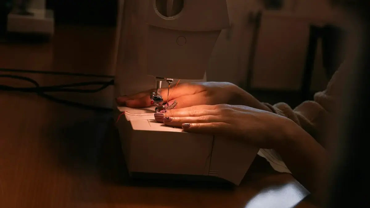 a hand holding a white box